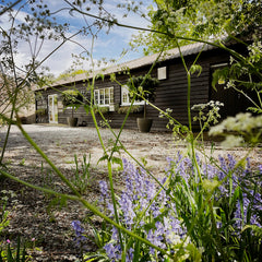 The Artisan Smokehouse's barn and car park