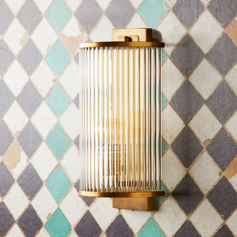 Roddy wall sconce in antiqued brass