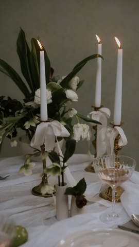 silk ribbons around candlesticks