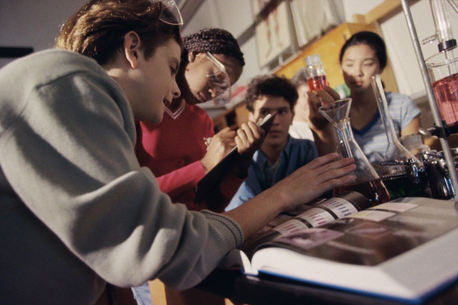 a group of students conducting an experiment