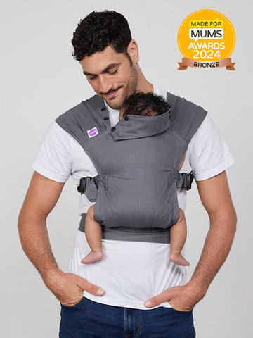 Man carries baby in Izmi Baby Carrier