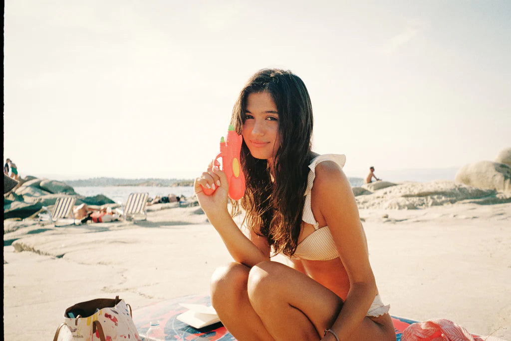Woman having fun in water at beach