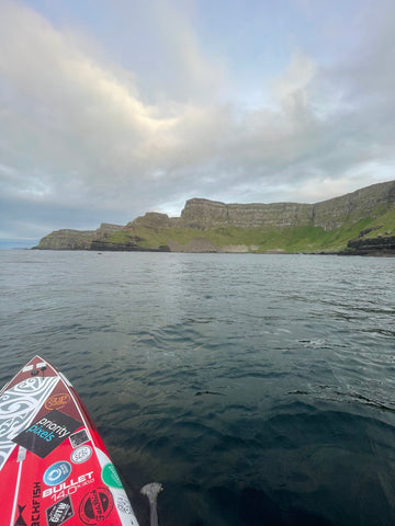Brendon Paddling Northern Ireland with the Giants Causeway in the background