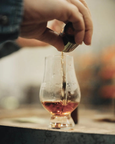 Is it whiskey or whisky? Pouring our whisk(e)y blend pouring into a whiskey glass.