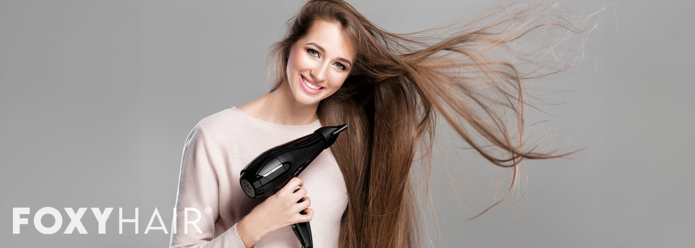 Woman blowing drying and air drying hair extensions