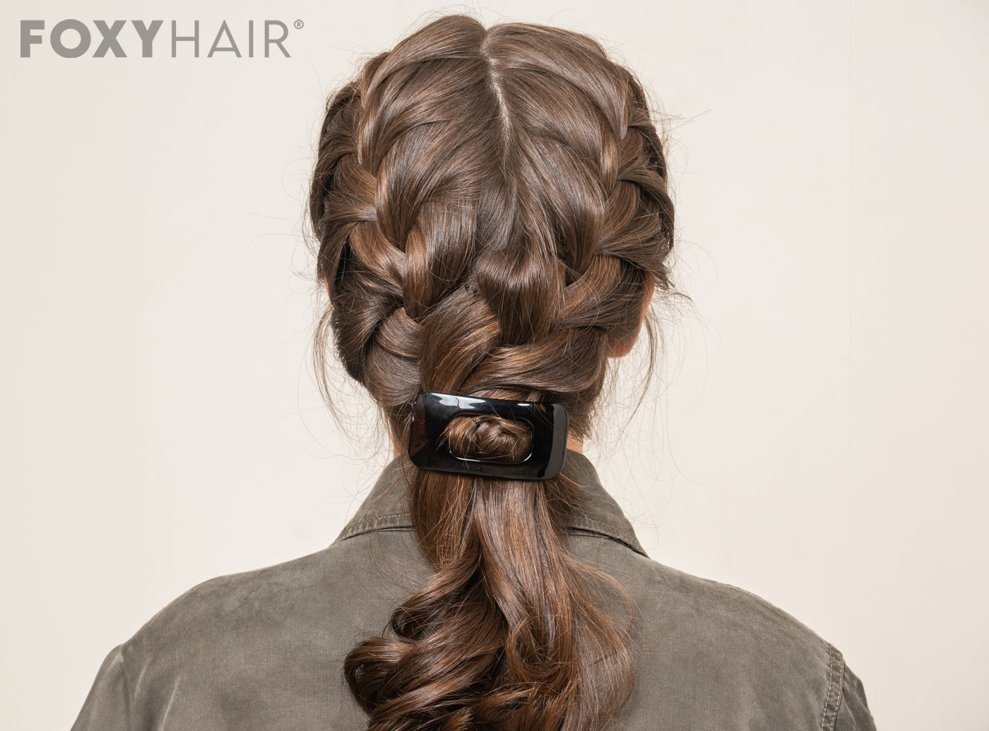 Woman with elegantly concealed extensions in braided hairstyles
