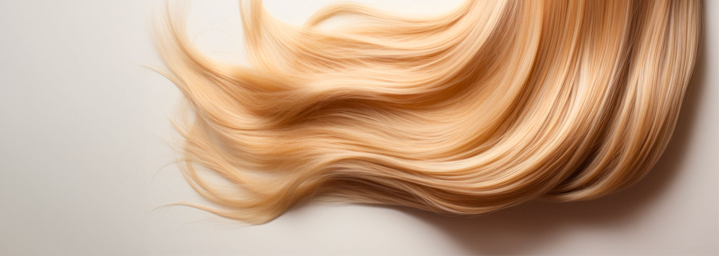 A woman holding seamless clip-in hair extensions