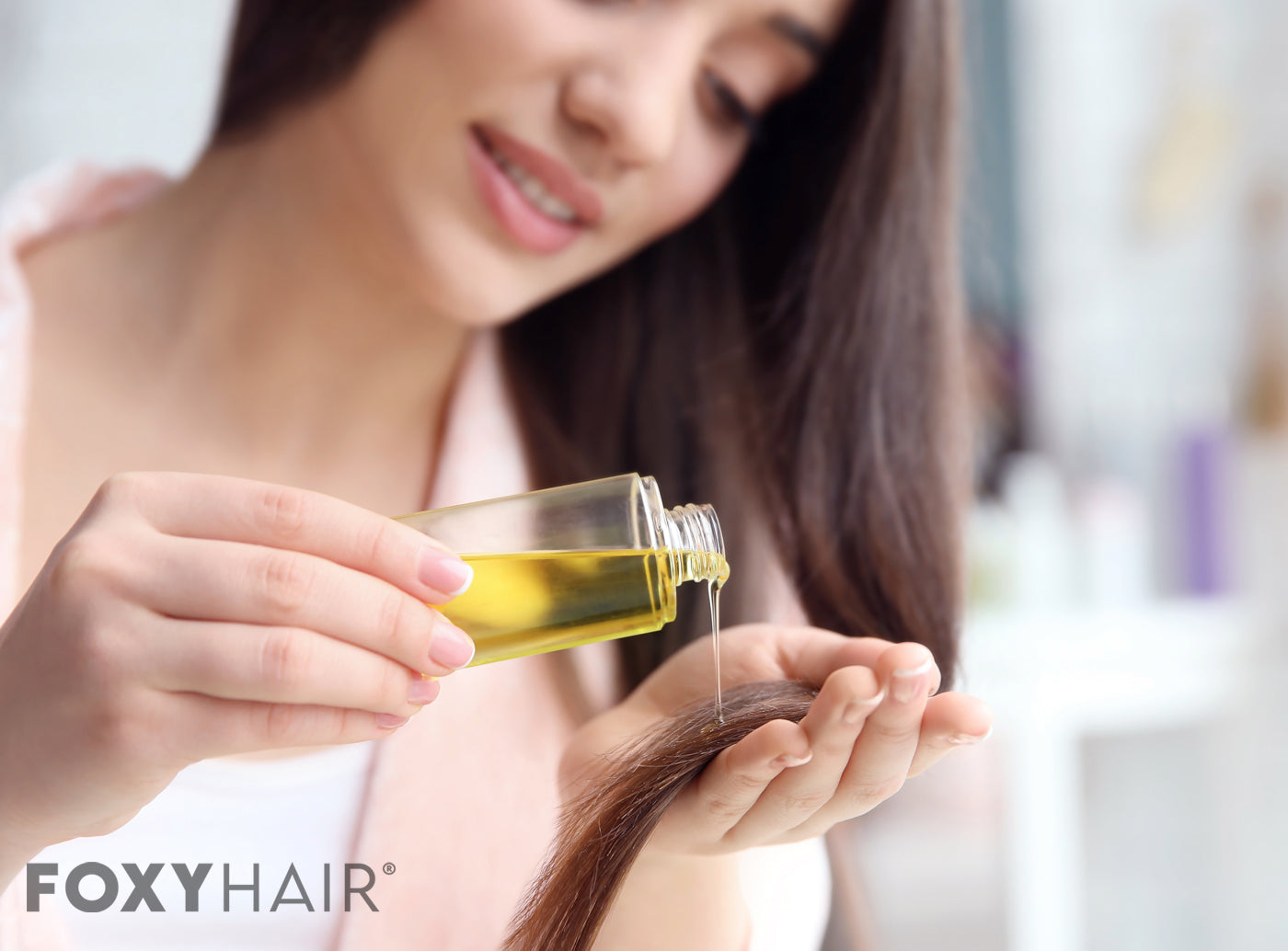 woman pouring oil into hair extensions