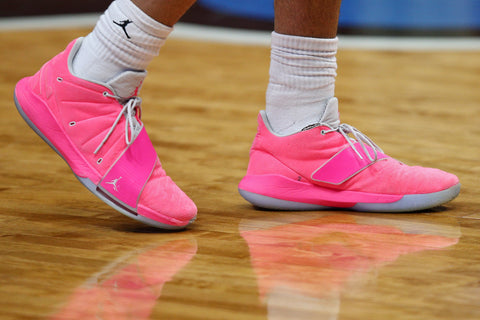 Clean basketball shoes on a court showcasing enhanced grip after being cleaned with Matguard's disinfectant products.