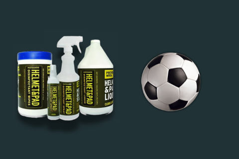 Matguard disinfectant spray and wipes positioned alongside a soccer ball, highlighting effective cleaning and maintenance tools.