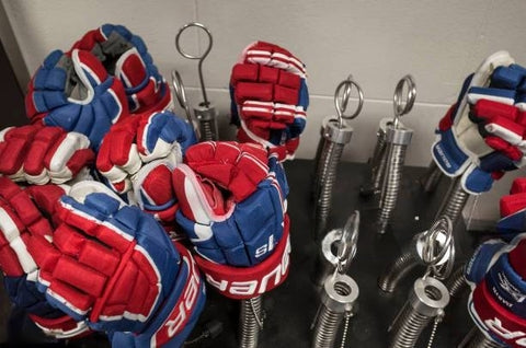 Air drying hockey gloves in a well-ventilated space.