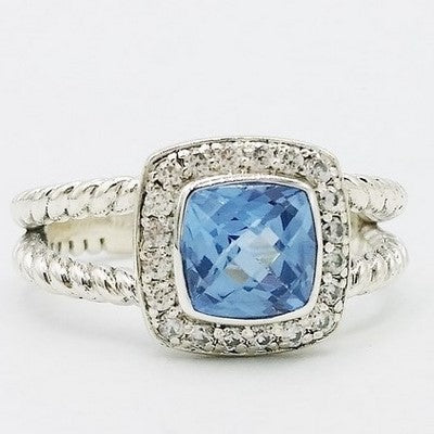 anillo de compromiso de plata con topacio azul