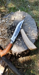 further shaping of wooden machete handle with large knife