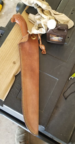 Treating the leather sheath with neatsfoot oil to protect it