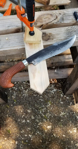 shaping the outside of the sheath using your parang as a drawknife