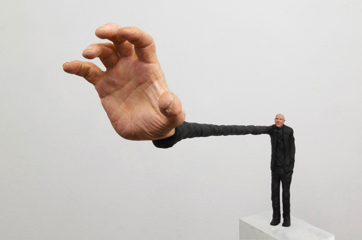 Gerardo Feldstein Sculpture of a man with extra large hand and small body