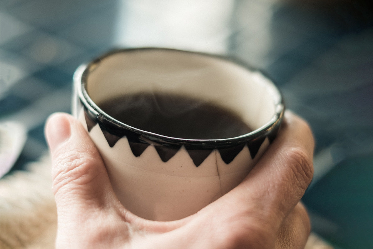 Holding coffee in a coffee cup