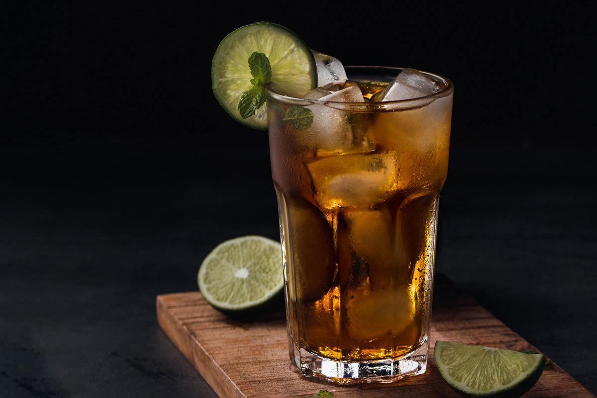 An image of fika made with KOBBS's Earl Gray, which uses fragrant bergamot to create a gorgeous flavored tea, and is made into cold brew iced tea and garnished with lime.