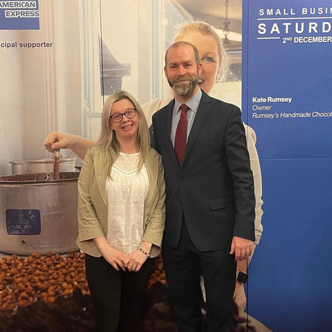 Hayley Kellard stood in front of a Small Business Saturday banner with MP Jonathan Reynolds