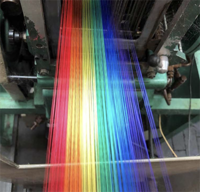 Rainbow yarn on the loom