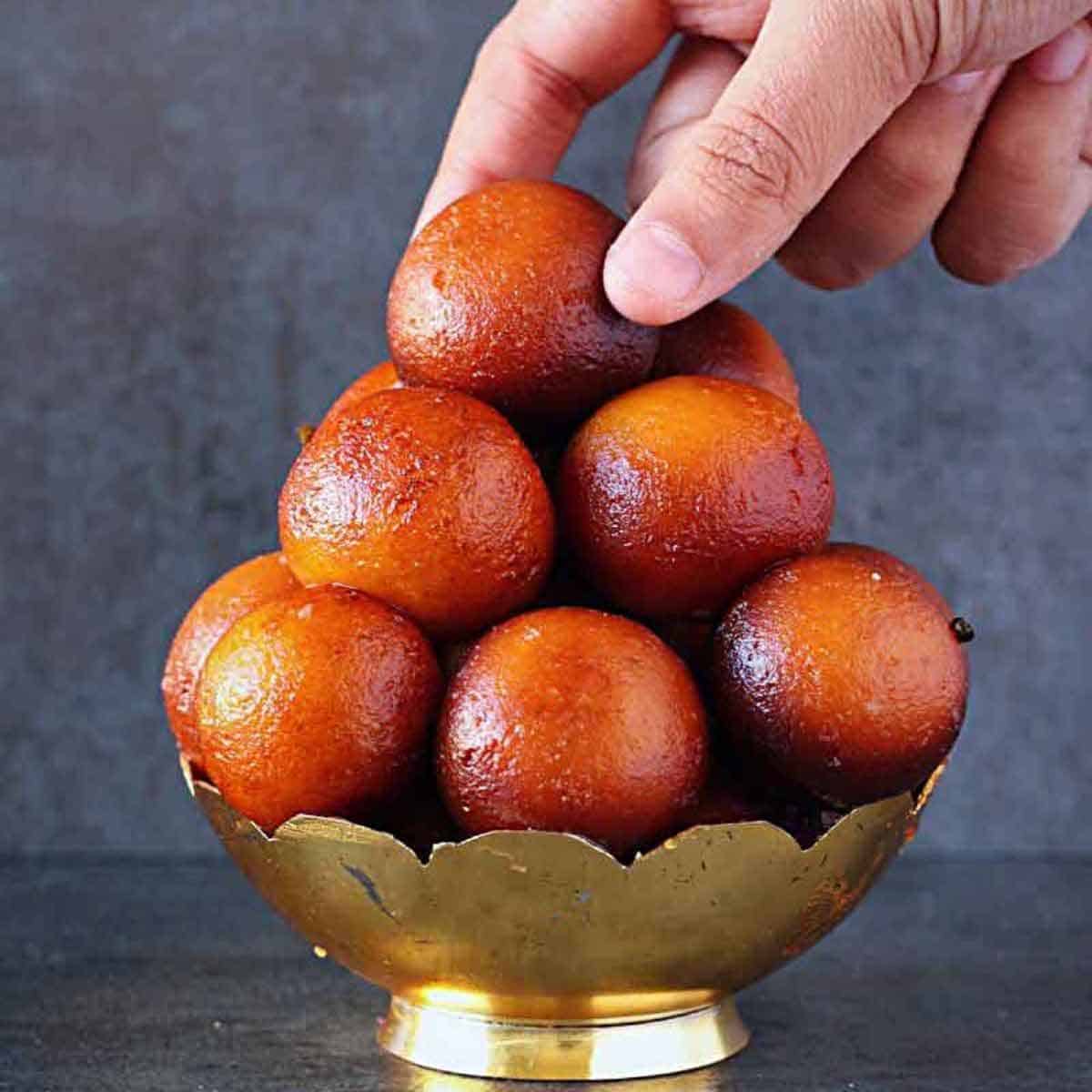 Gulab Jamun is a deep-fried ball of milk, flavorings, and sugar, a few inches in diameter.