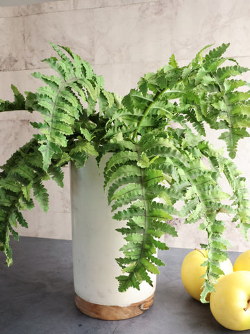 The Chateau marble wine cooler makes a lovely planter for faux greens