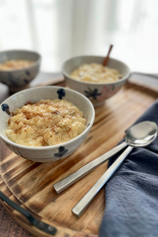 Rice pudding served on the Aria Scorched Wood Serving Tray with Handles