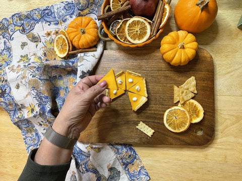 Putting together pumpkin pie cheese bites on the Alto Acacia Wood Cutting Board