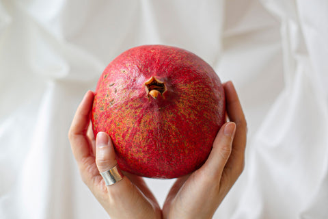 The pomegranate brings good luck, abundance, and fertility.