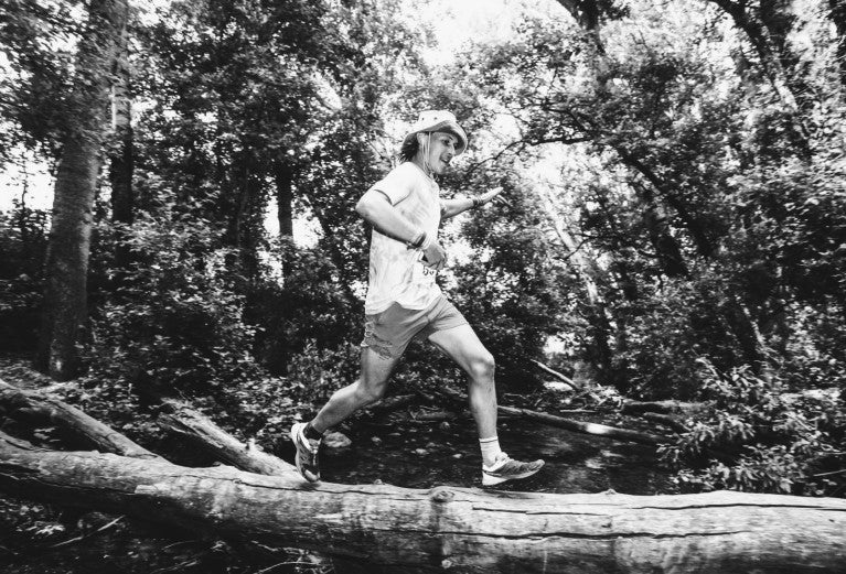 Robbie running on a log