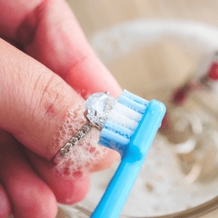 Clean jewelry with brush