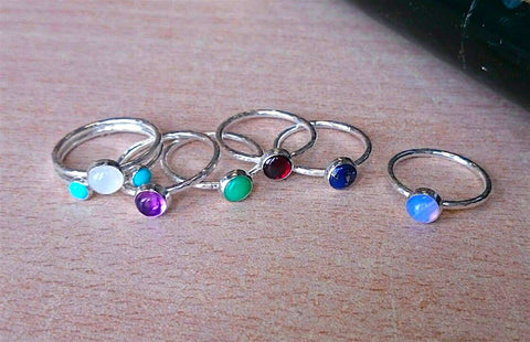 Sterling Silver Stacking Rings with gemstone setting detailing.