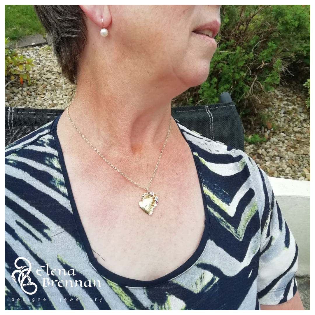 A happy customer and mum with her 14ct gold heart pendant that she will cherish forever.