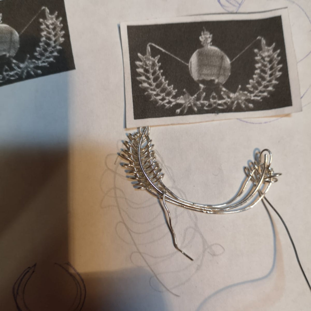 Starting to add detail to the Old Military Brooch using the photograph for reference.