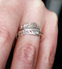 Cherish the baby angel feather ring.