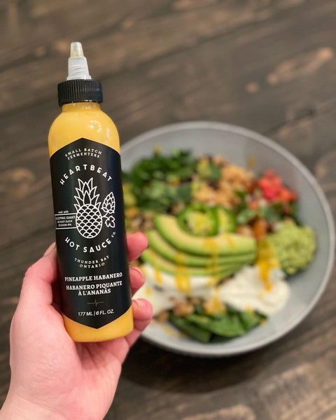 sweet and spicy Pineapple Habanero Hot Sauce on Loaded Burrito Bowl with Lingcod