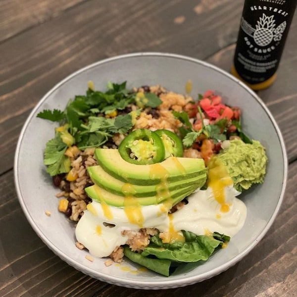 Loaded Burrito Bowl with Lingcod topped with Pineapple Habanero Hot Sauce