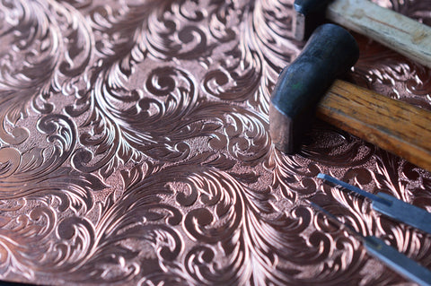 Copper plate carved with curved patterns