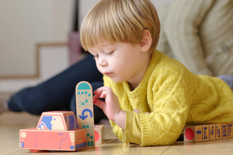 Kid playing with Cody Block