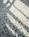Image of a tile floor with sunlight on it