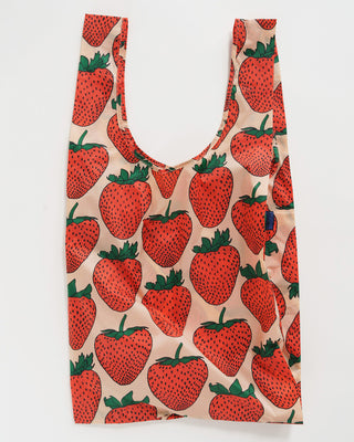 big baggu in blush pink with large red strawberry pattern