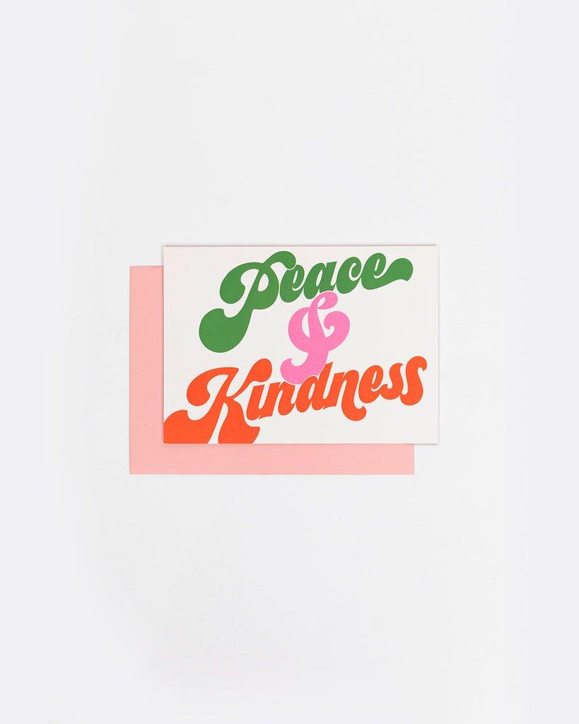 white card with the words peace and kindness