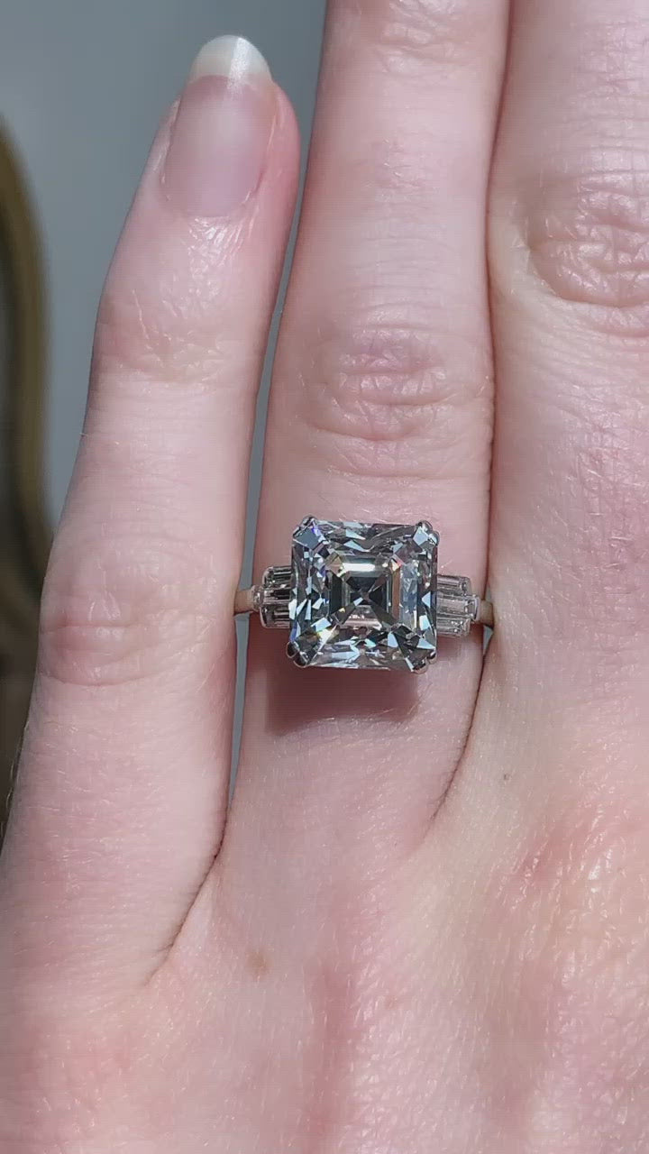 asscher cut diamond on hand