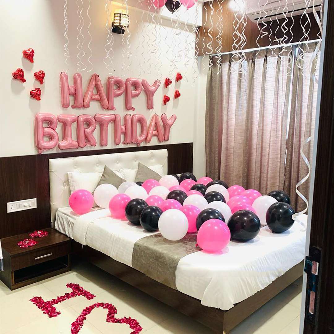 Birthday room decoration with a balloon ceiling