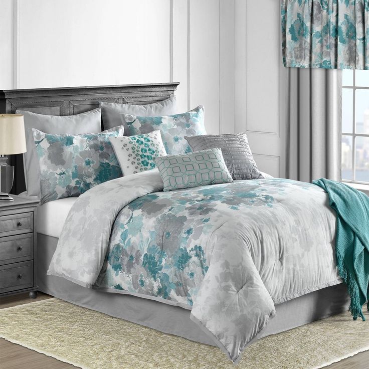 Teal bedding adding a pop of color to the bedroom