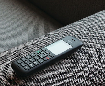 Gigaset C570 handset on sofa
