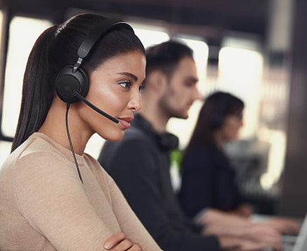 Woman taking call with Jabra headset