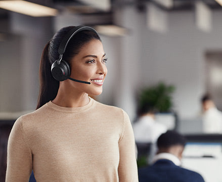 Woman with headset in office