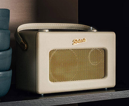 Angled view of cream Roberts radio on shelf