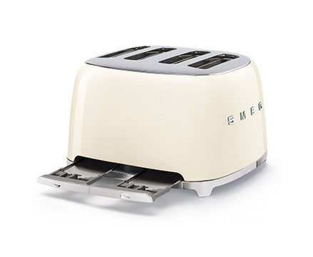 Cream Smeg toaster with crumb tray pulled out